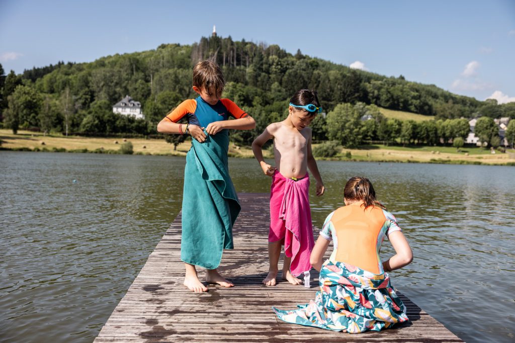 towels and children at the Tour d'Auvergne lake