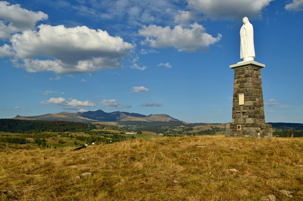 statue of Our Lady of Fatima and view of the Sancy massif