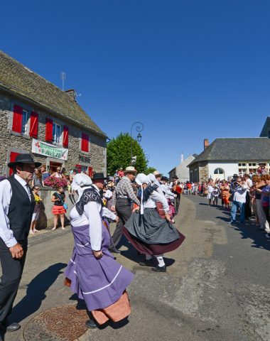 folk group during the flower float festival in Avèze on August 15